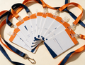 Printed PVC name badges fanned out with lanyards